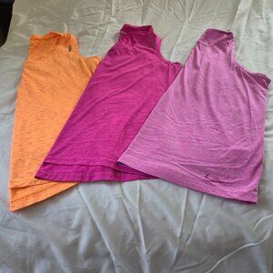 SET OF 3 (THREE) WORK OUT TANK TOPS. TWO REEBOK AND ONE NIKE - SIZE LARGE.